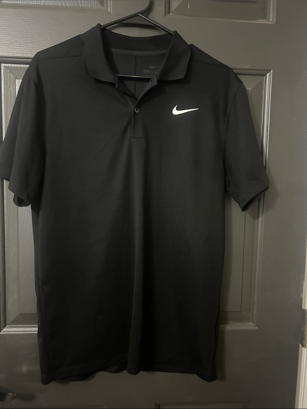 Nike Black Polo Shirt with White Swoosh